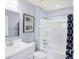 Clean and modern bathroom with white vanity, tub, and shower at 6941 E Bean Blossom Dr, Camby, IN 46113