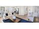 Open living room with beige sofas and a kitchen view at 6941 E Bean Blossom Dr, Camby, IN 46113