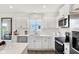 Bright kitchen featuring stainless steel appliances and white cabinetry at 6941 E Bean Blossom Dr, Camby, IN 46113