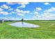 Large backyard with grassy lawn and covered patio at 6941 E Bean Blossom Dr, Camby, IN 46113
