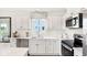 Modern kitchen with stainless steel appliances and white cabinets at 6941 E Bean Blossom Dr, Camby, IN 46113