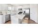 White kitchen with stainless steel appliances and island at 6941 E Bean Blossom Dr, Camby, IN 46113