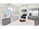 Modern kitchen featuring white cabinets and stainless steel appliances at 6941 E Bean Blossom Dr, Camby, IN 46113