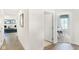 Bright hallway with light flooring and access to living room and office at 6941 E Bean Blossom Dr, Camby, IN 46113