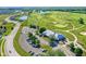 Aerial view of community with golf course, clubhouse, pool, and playground at 6941 E Bean Blossom Dr, Camby, IN 46113