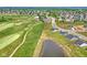 Community overview with pond and golf course at 6941 E Bean Blossom Dr, Camby, IN 46113