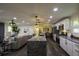 Modern kitchen with granite island, stainless steel appliances, and white cabinets at 8827 El Rico Dr, Indianapolis, IN 46240