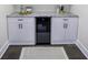 Basement wet bar with granite countertop and wine cooler at 8827 El Rico Dr, Indianapolis, IN 46240