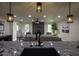 Modern kitchen with granite island and black sink at 8827 El Rico Dr, Indianapolis, IN 46240