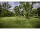 Large backyard with mature trees and a private setting at 8827 El Rico Dr, Indianapolis, IN 46240
