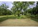 Spacious deck overlooking a lush, tree-filled backyard at 8827 El Rico Dr, Indianapolis, IN 46240