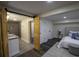 Basement bathroom with double vanity and a walk-in shower at 8827 El Rico Dr, Indianapolis, IN 46240