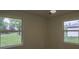 Spacious spare bedroom with two large windows and plenty of natural light at 8827 El Rico Dr, Indianapolis, IN 46240