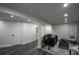 Finished basement features a sitting area, hardwood floors, and multiple rooms at 8827 El Rico Dr, Indianapolis, IN 46240