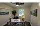 Bright home office features a large window, built-in desk, and stylish artwork at 8827 El Rico Dr, Indianapolis, IN 46240