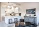 Open living area with kitchen island and gray wood cabinet at 1336 Central Ave, Indianapolis, IN 46202
