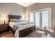 Comfortable bedroom with king-size bed and private access to patio at 1336 Central Ave, Indianapolis, IN 46202