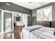 Bedroom with barn door closet and hardwood floors at 1336 Central Ave, Indianapolis, IN 46202