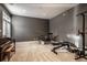 Spacious basement recreation area with gym equipment and piano at 1336 Central Ave, Indianapolis, IN 46202