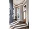Bright entryway with a wooden staircase and large windows at 1336 Central Ave, Indianapolis, IN 46202