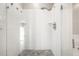 Spacious shower with multiple shower heads and pebble floor at 1336 Central Ave, Indianapolis, IN 46202