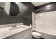 Clean bathroom with shower/tub combo, modern vanity, and dark grey walls at 1336 Central Ave, Indianapolis, IN 46202