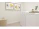 Bright laundry room with washer, dryer, and stylish storage at 3798 Andean Dr, Bargersville, IN 46106