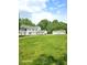 Large white house with detached garage and expansive green space at 1515 S Park Ave, Alexandria, IN 46001