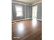 Spacious living room with hardwood floors and large windows at 1515 S Park Ave, Alexandria, IN 46001