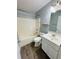 Clean bathroom with a bathtub, toilet and vanity at 7020 Ira Ct, Indianapolis, IN 46217