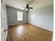 Bright bedroom with hardwood floors and a ceiling fan at 7020 Ira Ct, Indianapolis, IN 46217