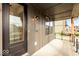 Modern front porch with dark brown door and a metal railing at 11529 Langton Walk # 26, Zionsville, IN 46077