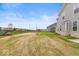 Spacious backyard with open area and partial view of neighboring homes at 15287 Garden Mist Pl, Fishers, IN 46037