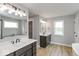 Bathroom with double vanity and a large mirror at 15287 Garden Mist Pl, Fishers, IN 46037