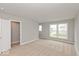 Bedroom with two windows and access to a hallway at 15287 Garden Mist Pl, Fishers, IN 46037