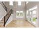 Bright Gathering room with vaulted ceiling, large windows, and access to backyard at 15287 Garden Mist Pl, Fishers, IN 46037