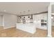 Modern kitchen with white cabinets, quartz countertops, and a large island at 15287 Garden Mist Pl, Fishers, IN 46037