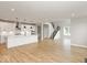 Open concept kitchen features a large island, white cabinets, and stainless steel appliances at 15287 Garden Mist Pl, Fishers, IN 46037