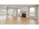 Spacious living room with hardwood floors and a fireplace at 15287 Garden Mist Pl, Fishers, IN 46037