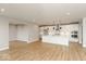 Open concept living room and kitchen with hardwood floors at 15287 Garden Mist Pl, Fishers, IN 46037