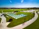 Aerial view of community with pickleball courts and playground at 15287 Garden Mist Pl, Fishers, IN 46037