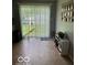 Kitchen with tile floor and sliding door to backyard at 3920 E 30Th St, Indianapolis, IN 46218