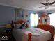 Bedroom with a queen bed and light blue walls at 909 E 38Th St, Indianapolis, IN 46205