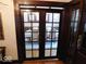 Elegant dining room, partially visible through glass doors at 909 E 38Th St, Indianapolis, IN 46205