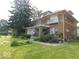 Two story home with a balcony and landscaping at 909 E 38Th St, Indianapolis, IN 46205