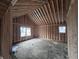 Interior framing of a new home's room, showing walls and windows at 1818 Ingram St, Indianapolis, IN 46218