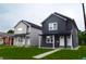 Two new construction homes; one gray, one dark gray, with a modern farmhouse style at 1818 Ingram St, Indianapolis, IN 46218