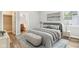 Spacious bedroom with a neutral color palette and en-suite bathroom at 1818 Ingram St, Indianapolis, IN 46218