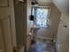 Small bathroom with pedestal sink and tub at 3310 N Kenwood Ave, Indianapolis, IN 46208