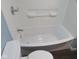 Clean bathroom with a new bathtub and tile surround at 3912 Terrace Ave, Indianapolis, IN 46203